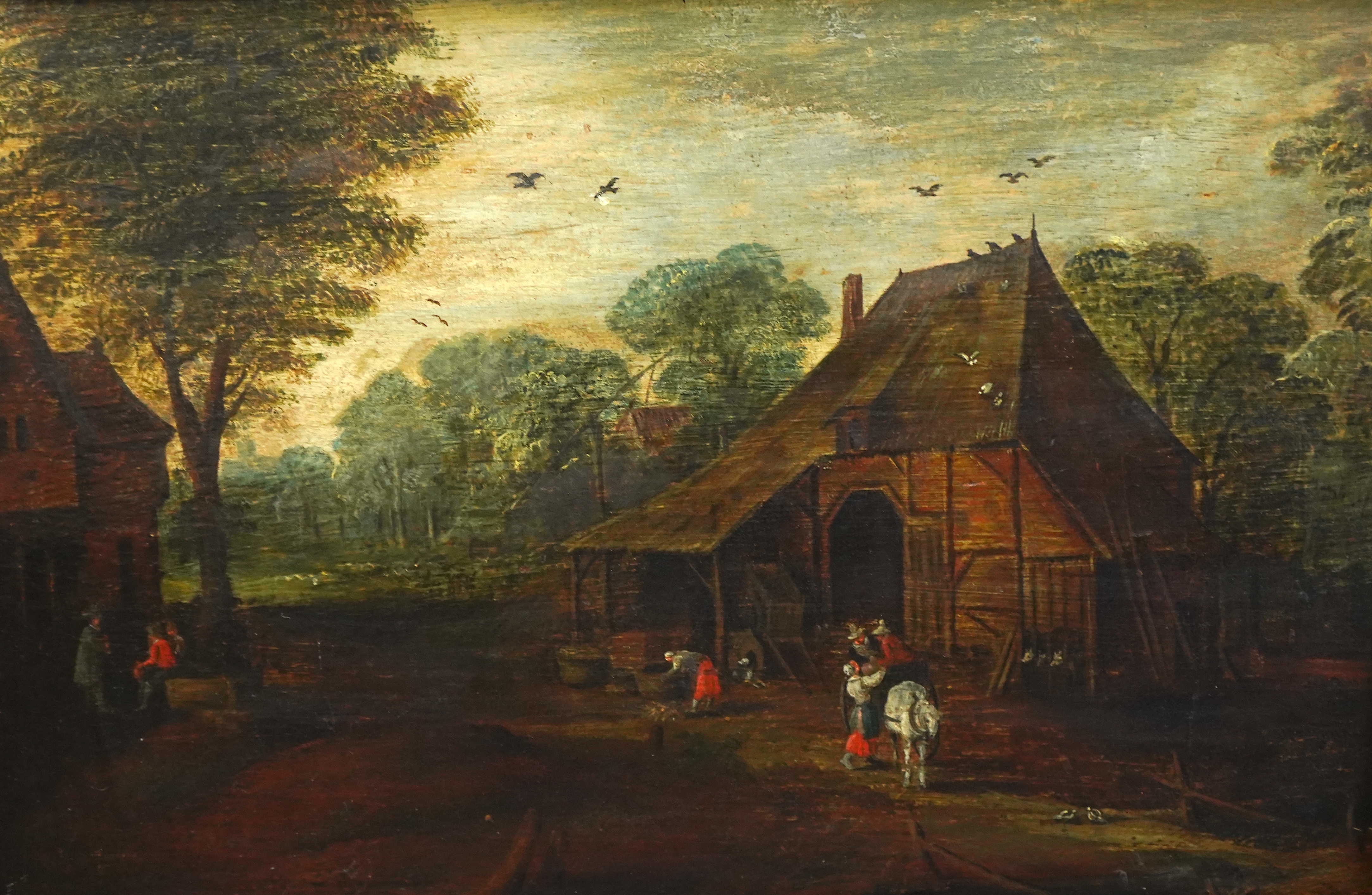 Follower of Jan Breughel the Elder (1568-1625), Village scene with figures beside a house, oil on panel, 34 x 51cm